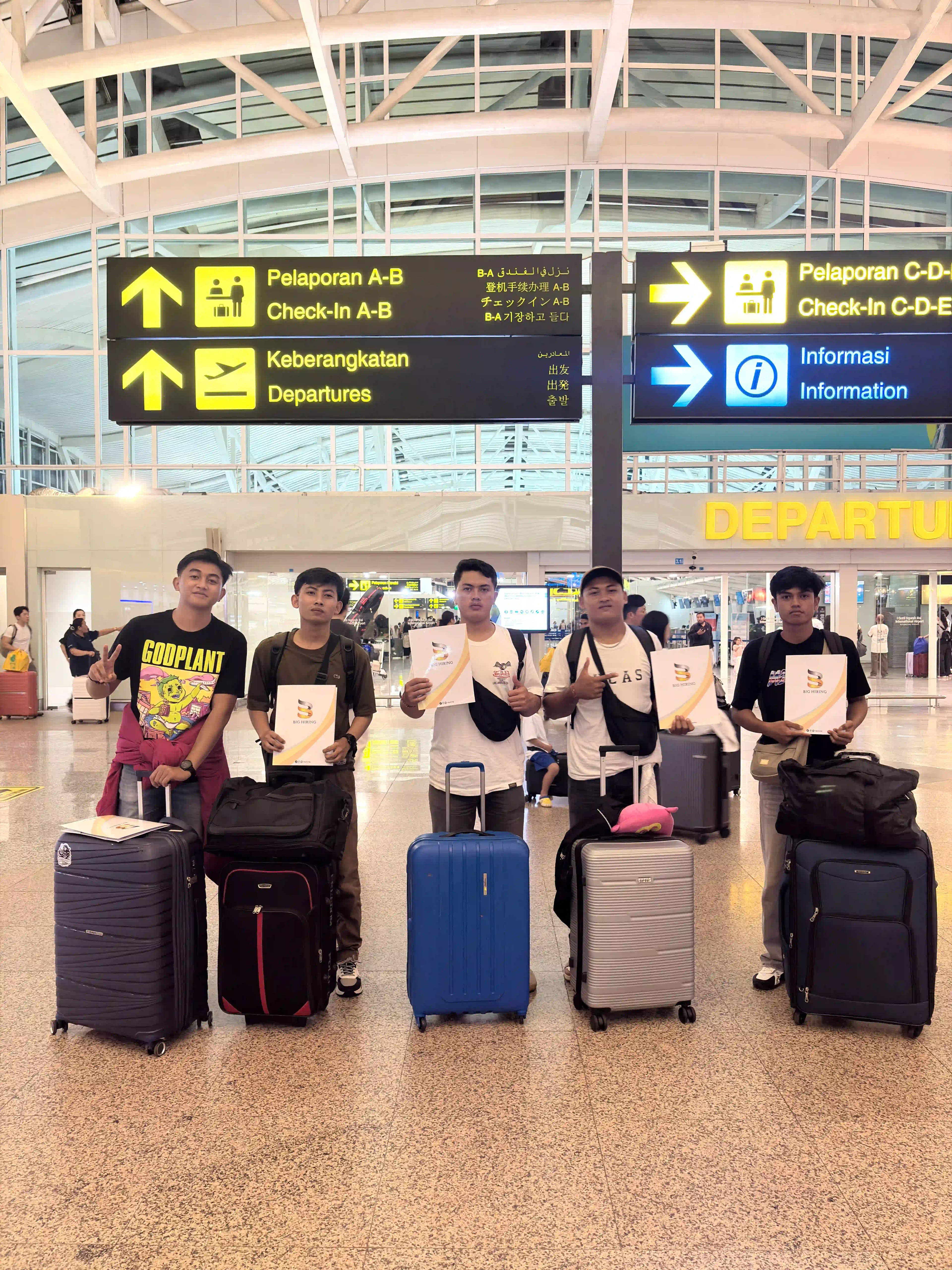 Big Hiring candidates with luggage at an international departure terminal